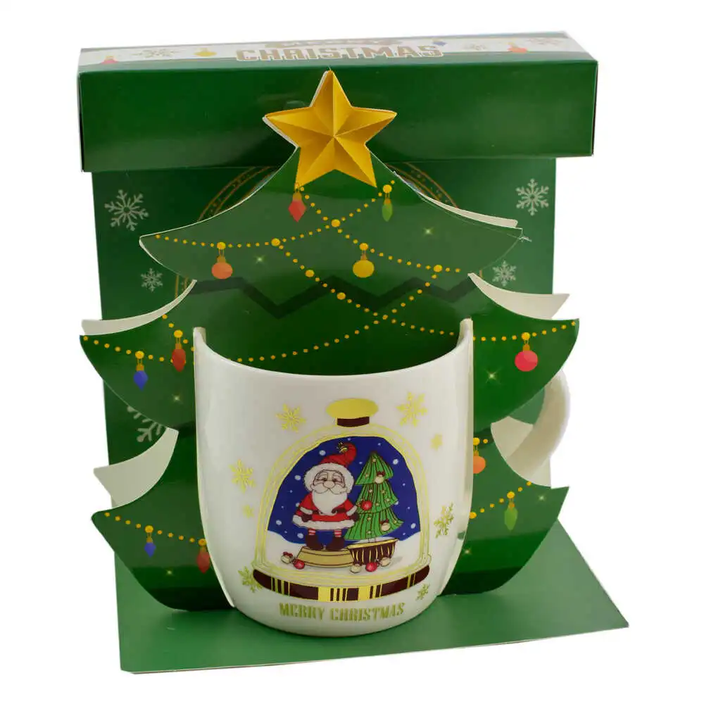 Cana de craciun realizata din ceramica in cutie - Design cu Mos Nicolae si inscriptia "Merry Christmas" - Diverse modele Cana de craciun realizata din ceramica in cutie - Design cu Mos Nicolae si inscriptia "Merry Christmas" - Diverse modele