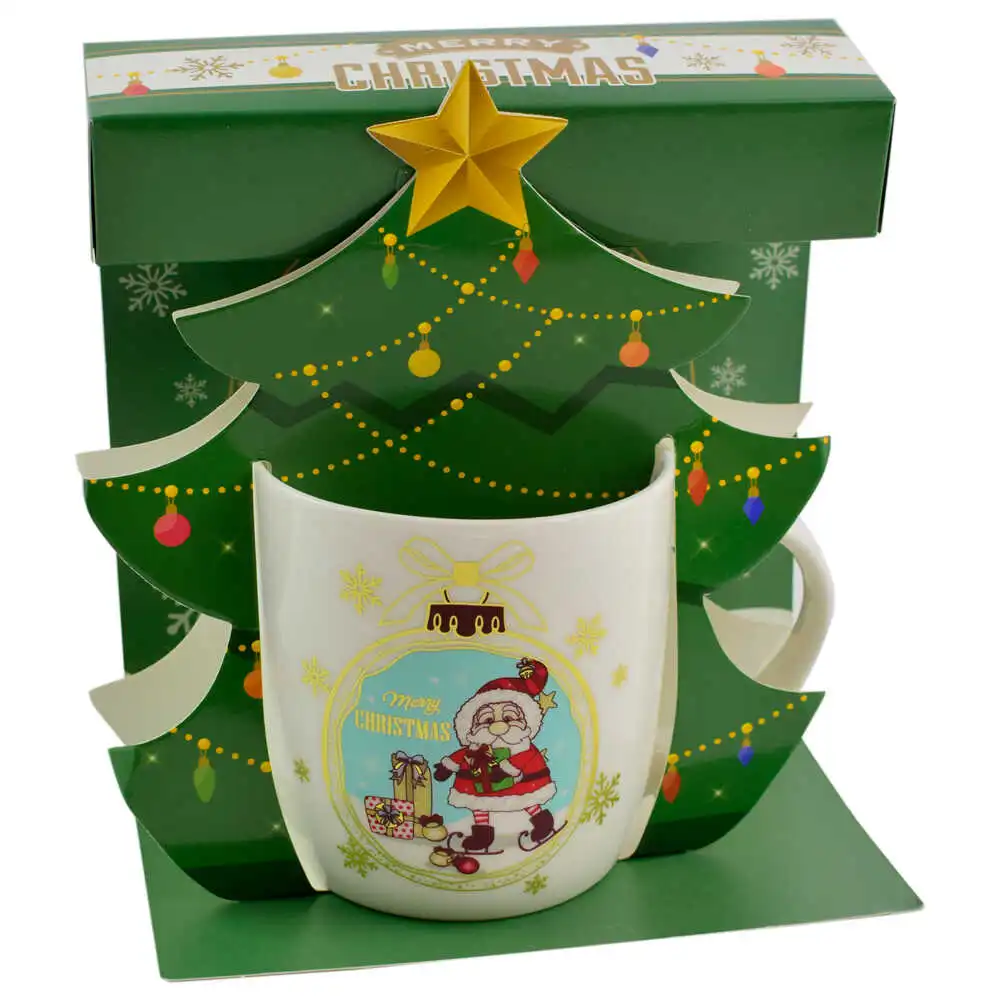 Cana de craciun realizata din ceramica in cutie - Design cu Mos Nicolae si inscriptia "Merry Christmas" - Diverse modele Cana de craciun realizata din ceramica in cutie - Design cu Mos Nicolae si inscriptia "Merry Christmas" - Diverse modele