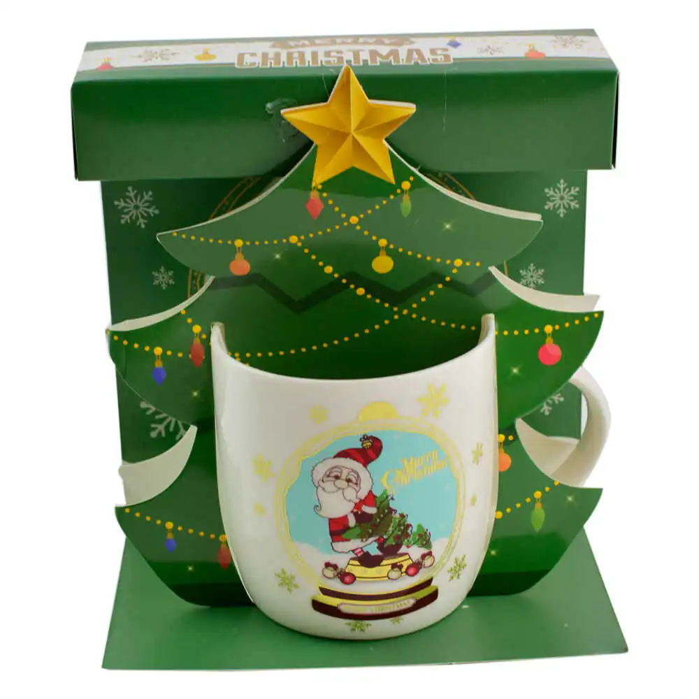 Cana de craciun realizata din ceramica in cutie - Design cu Mos Nicolae si inscriptia "Merry Christmas" - Diverse modele Cana de craciun realizata din ceramica in cutie - Design cu Mos Nicolae si inscriptia "Merry Christmas" - Diverse modele