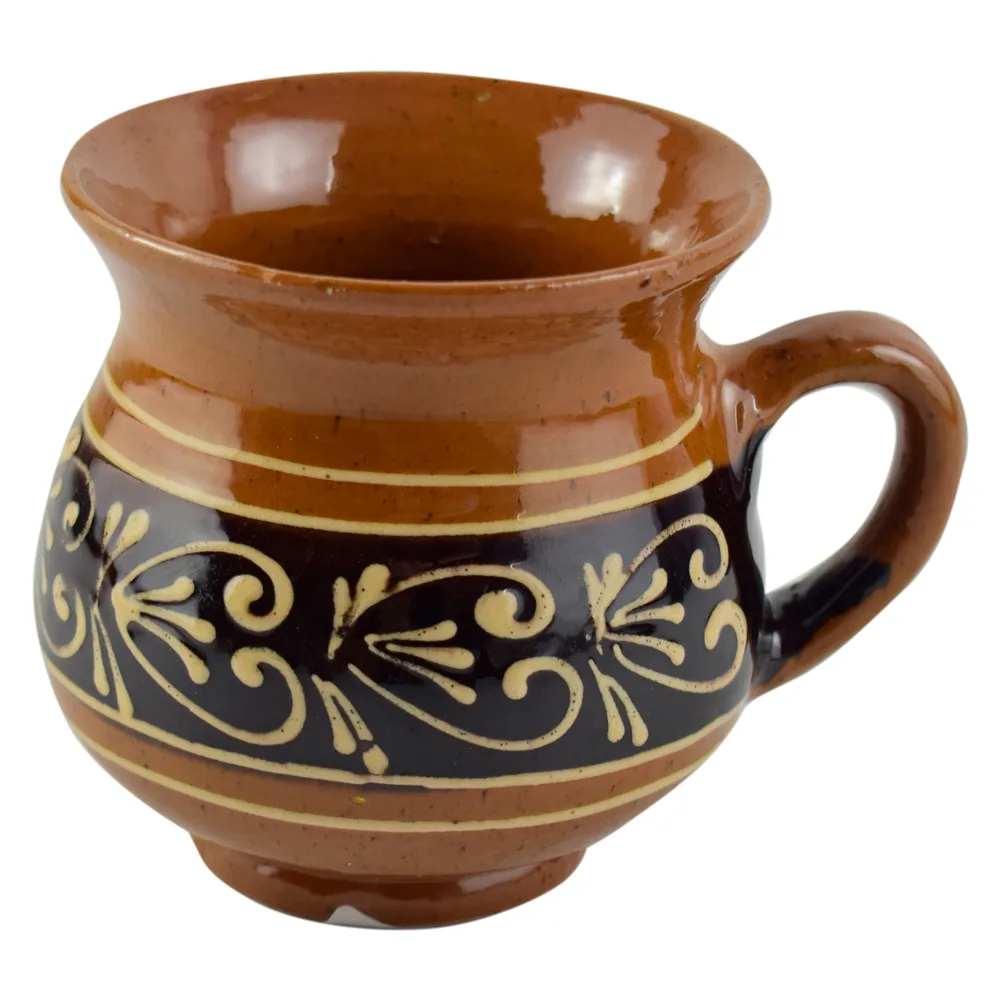 Cana groasa pentru ceai din ceramica. decorata cu motive populare Cana groasa pentru ceai din ceramica. decorata cu motive populare
